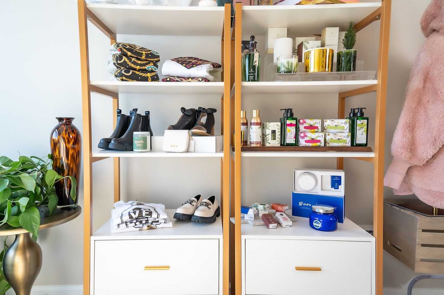 Stylish shelves displaying shoes, beauty products, books, and decor items in a chic setting.